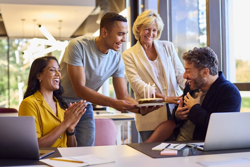 staff celebrating birthday of male colleague at de 2024 10 19 13 11 14 utc